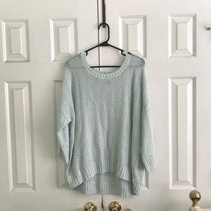 A light blue sweater